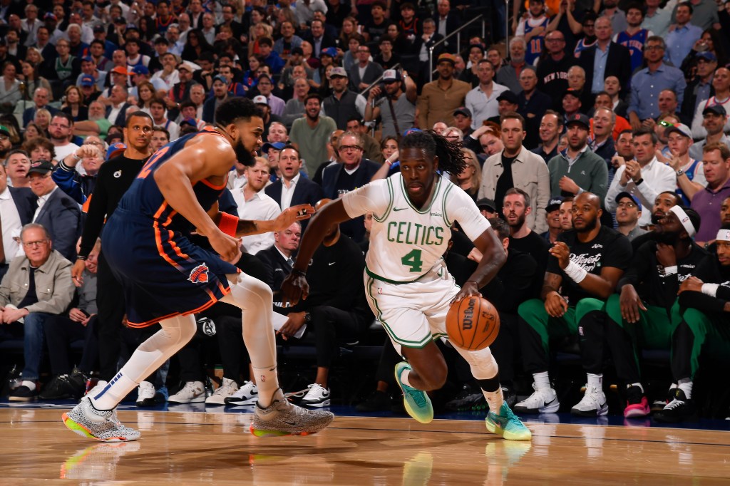 Jrue Holiday #4 of the Boston Celtics dribbling the ball during a game against the New York Knicks.