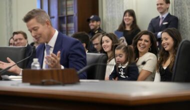With his family sitting behind him, current Transportation Secretary Sean Duffy testifies before the Senate Commerce, Science, and Transportation Committee on Capitol Hill in Washington, Jan. 15, 2025, for his nomination.