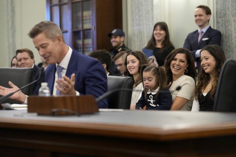 With his family sitting behind him, current Transportation Secretary Sean Duffy testifies before the Senate Commerce, Science, and Transportation Committee on Capitol Hill in Washington, Jan. 15, 2025, for his nomination.