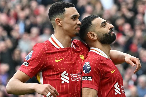 Mohamed Salah (R) celebrates scoring a goal with Trent Alexander-Arnold