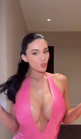 Instagram/Kylie Jenner Jenner's bodysuit was bright bubblegum pink and plunged to her stomach