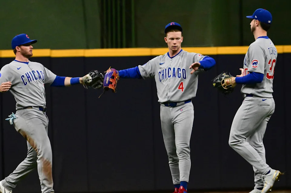 Chicago Cubs left fielder Ian Happ (8), center fielder Pete Crow-Armstrong (4), and right fielder Kyle Tucker (30) celebrate after beating the Milwaukee Brewers at American Family Field.Benny Sieu-Imagn Images