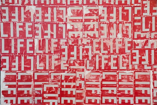 Waymond Harrison uses the LIFE Magazine logo as his artist signature. He plans to use this canvas in particular to create a painting of Muhammad Ali. June 17, 2025.
