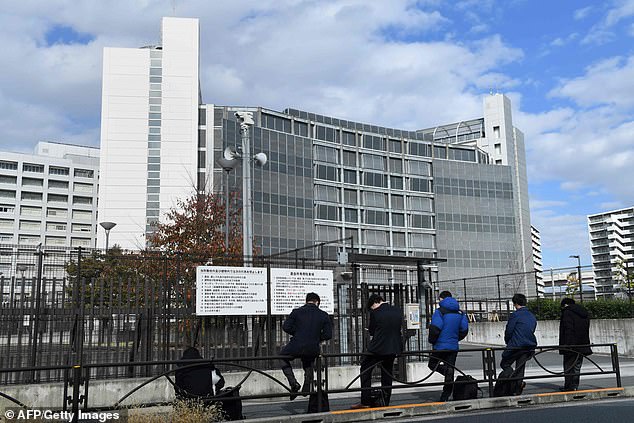 Journalists stand outside the grey Tokyo Detention House in Katsushika, November 20, 2018. There is a chilling theatrical element to how the East Asian country hangs the condemned