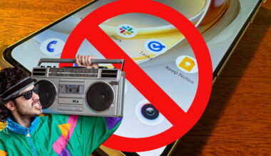 A man in 90s neon green jacket has a cassette boombox on his shoulder, and he stands in front of an Android phone with a large red circle and line through it.