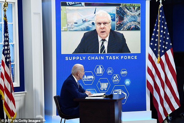 Smith is seen speaking to former president Joe Biden during a meeting with the Supply Chain Disruptions Task Force in 2021