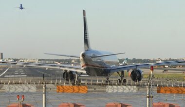 New York City 's LaGuardia Airport LGA issued a ground stop Sunday morning due to severe weather. (Pictured: Airplane on runway at LGA)