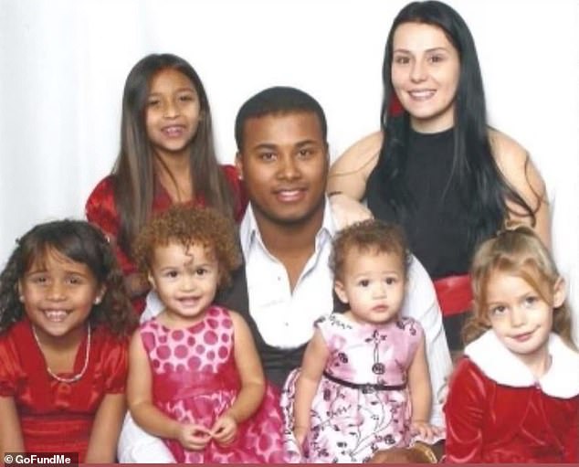 De La Cruz is pictured pre-diagnosis with her doctors. She said she did not begin to feel sick until she started chemo, which caused severe fatigue, brain fog, and nausea