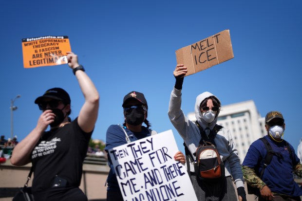 Protesters block the 101 Freeway near the metropolitan detention center...