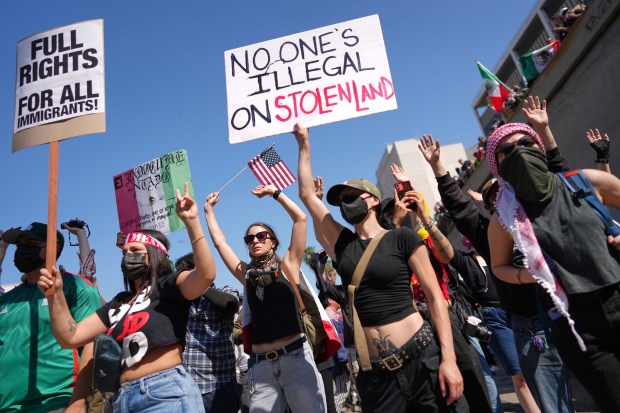 Protesters block the 101 Freeway near the metropolitan detention center...