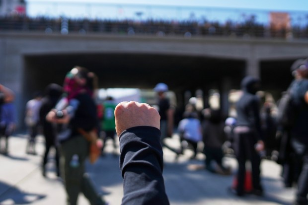 Protesters are seen on the 101 Freeway near the metropolitan...