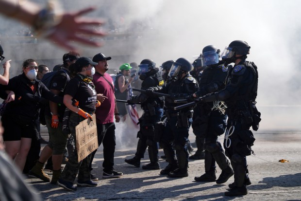 Protesters are seen on the 101 Freeway near the metropolitan...