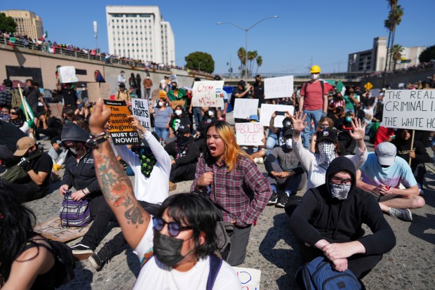 Protesters are seen on the 101 Freeway near the Metropolitan...