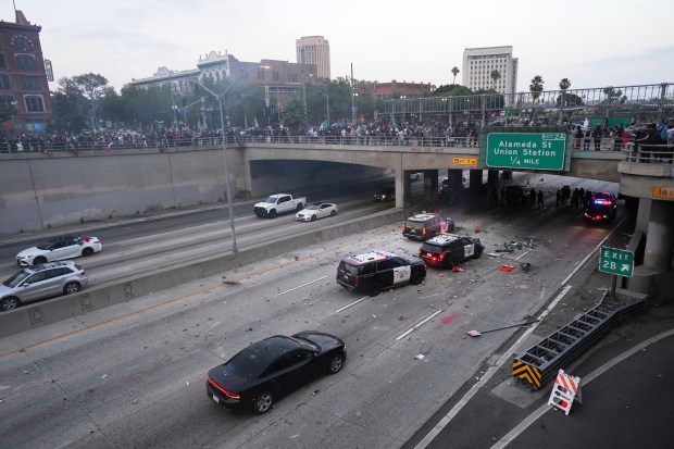 Protesters throw objects at California Highway Patrol vehicles on the...