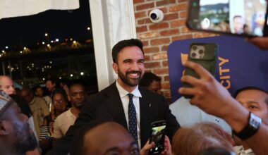 Zohran Mamdani takes selfies with supporters after speaking at his primary election party in New York. (AP Photo/Heather Khalifa)