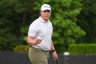 Aldrich Potgieter, of South Africa, waves after his putt on the ninth hole during the first...