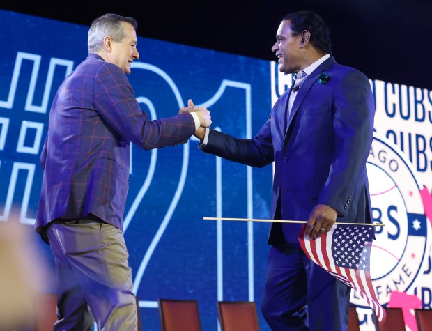 Cubs Chairman Tom Ricketts, left, and retired slugger Sammy Sosa...