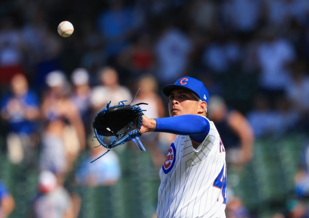 Cubs pitcher Daniel Palencia retrieves the ball after giving up a home run to Mariners catcher Cal Raleigh in the ninth inning at Wrigley Field on June 21, 2025, in Chicago. (John J. Kim/Chicago Tribune)