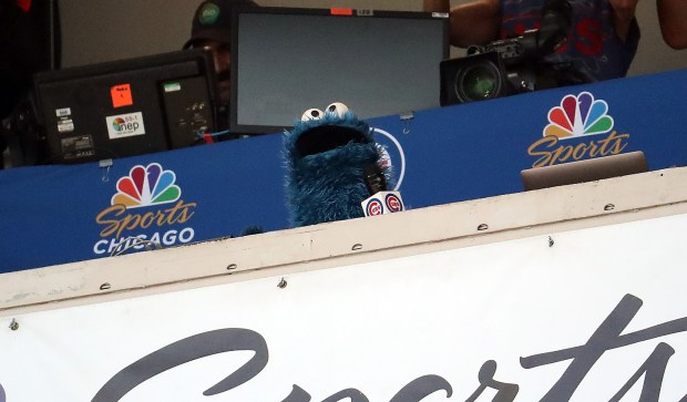 Cookie Monster sings Take Me Out to the Ballgame on June 27, 2019, at Wrigley Field. The Cubs defeated the Atlanta Braves 9-7. (Brian Cassella/Chicago Tribune)
