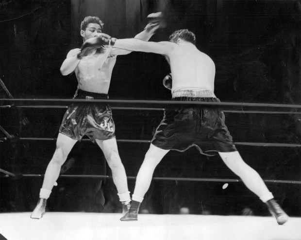 Joe Louis, left, and Jim Braddock during their historic June 22, 1937 fight at Comiskey Park in Chicago. (Chicago Tribune historical photo)