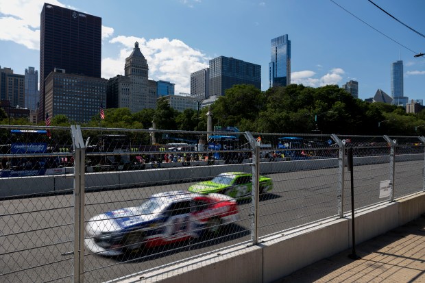 Cars race in the Xfinity Series during the first day of the NASCAR Chicago Street Race on July 6, 2024, at Grant Park. (Vincent Alban/Chicago Tribune)