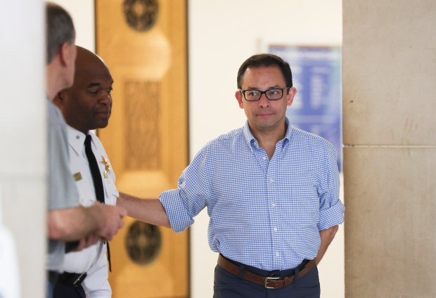 Ald. Raymond López, 15th, leaves the courtroom at the Leighton...