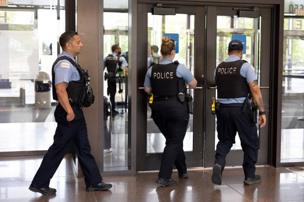 Chicago police officers leave the courtroom at the Leighton Criminal...