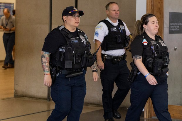 Chicago police officers leave the courtroom at the Leighton Criminal...