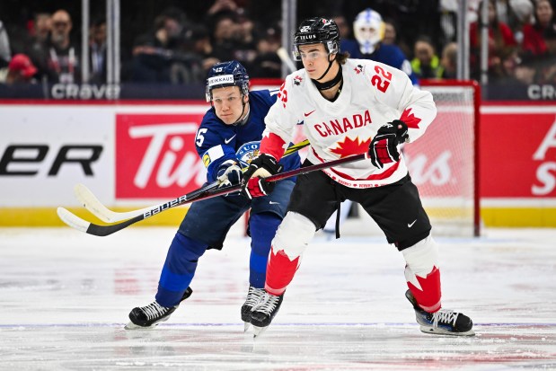 Canada's Porter Martone skates against Finland's Tuomas Uronen during the IIHF World Junior Championship on Dec. 26, 2024, in Ottawa. (Minas Panagiotakis/Getty Images)