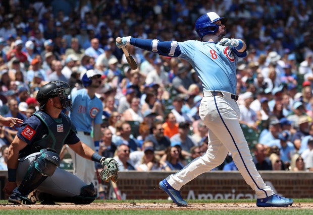 Chicago Cubs left fielder Ian Happ follows through on a solo home run in the first inning of a game against the Seattle Mariners at Wrigley Field in Chicago on June 20, 2025. (Chris Sweda/Chicago Tribune)