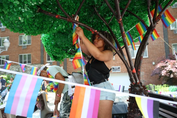 Celeste Patterson sets up a float before Chicago Pride Parade starts on June 29th, 2025. (Brian Cassella/Chicago Tribune)