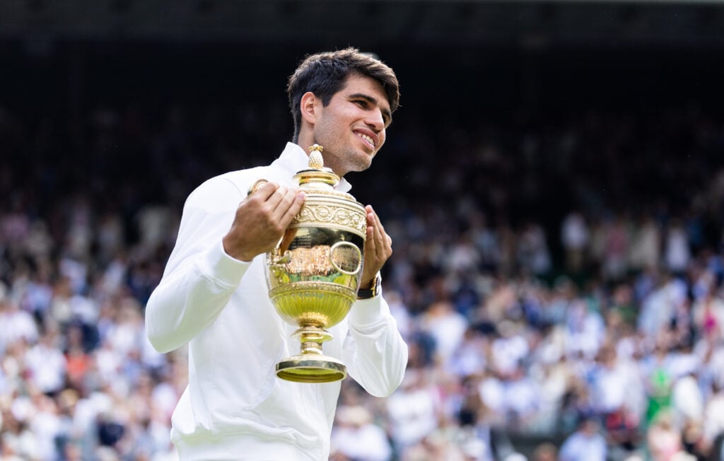 Carlos Alcaraz of Spain holds the trophy after defeating Novak Djokovic of Serbia