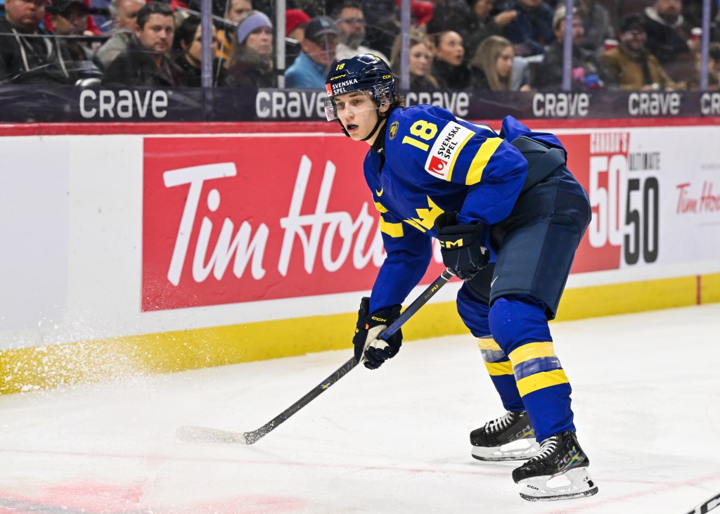 Victor Eklund #18 of Team Sweden skates in the second period against Team Finland of the semifinal match during the 2025 IIHF World Junior Championship at Canadian Tire Centre on January 4, 2025 in Ottawa, Ontario, Canada.