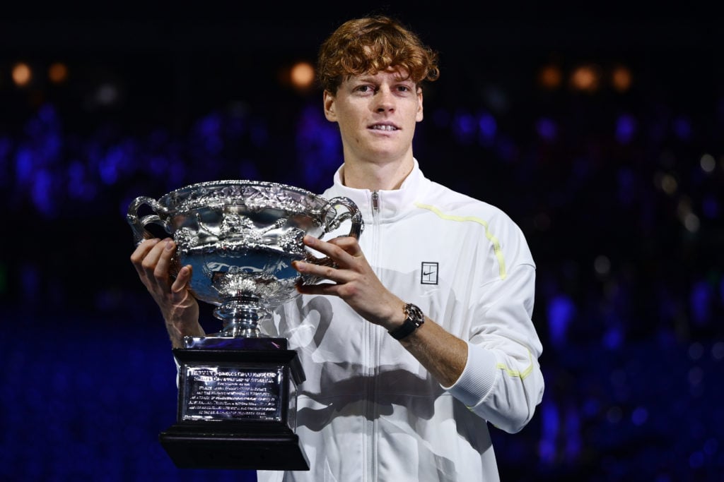 Jannik Sinner poses with the Australian Open trophy after beating Alexander Zverev in the final