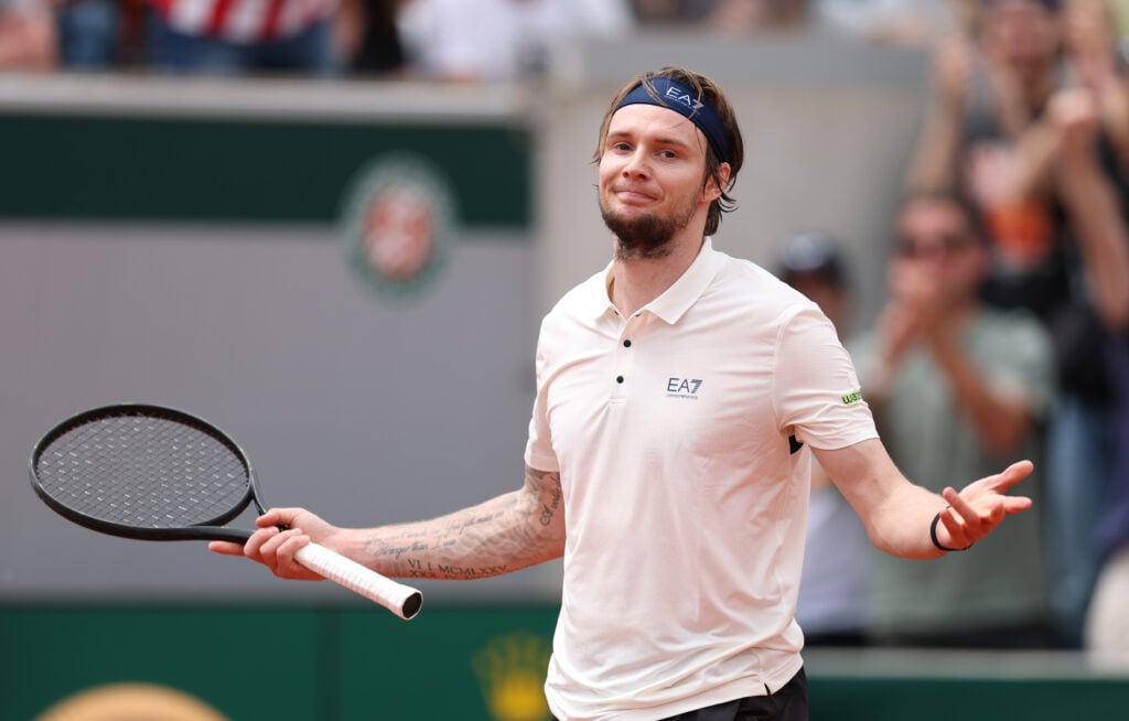 Alexander Bublik of Kazakhstan celebrates after winning the fourth set against Alex de Minaur of Australia during the Men's Singles Second Round match on Day Five of the 2025 French Open at Roland Garros.