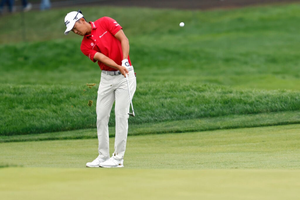 Michael Kim plays a pitch shot in round four of the US Open at Oakmont