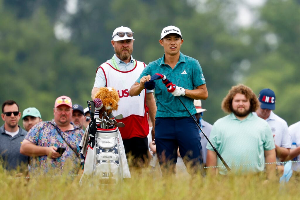 Collin Morikawa stands alongside Joe Greiner during the final round of the US Open at Oakmont