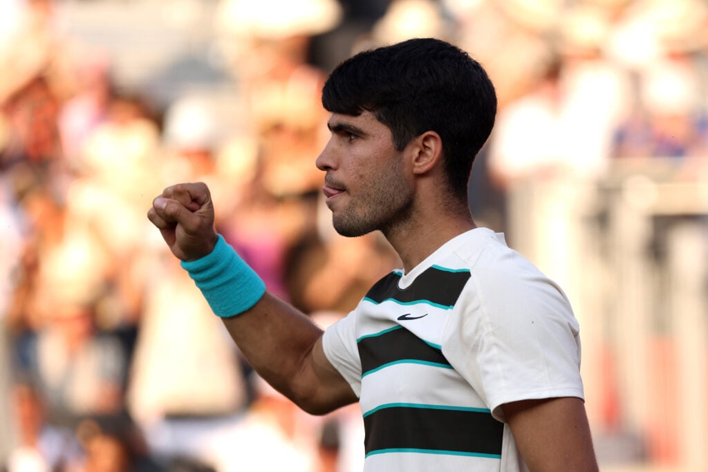 Carlos Alcaraz celebrates after defeating Jaume Munar at Queen's.