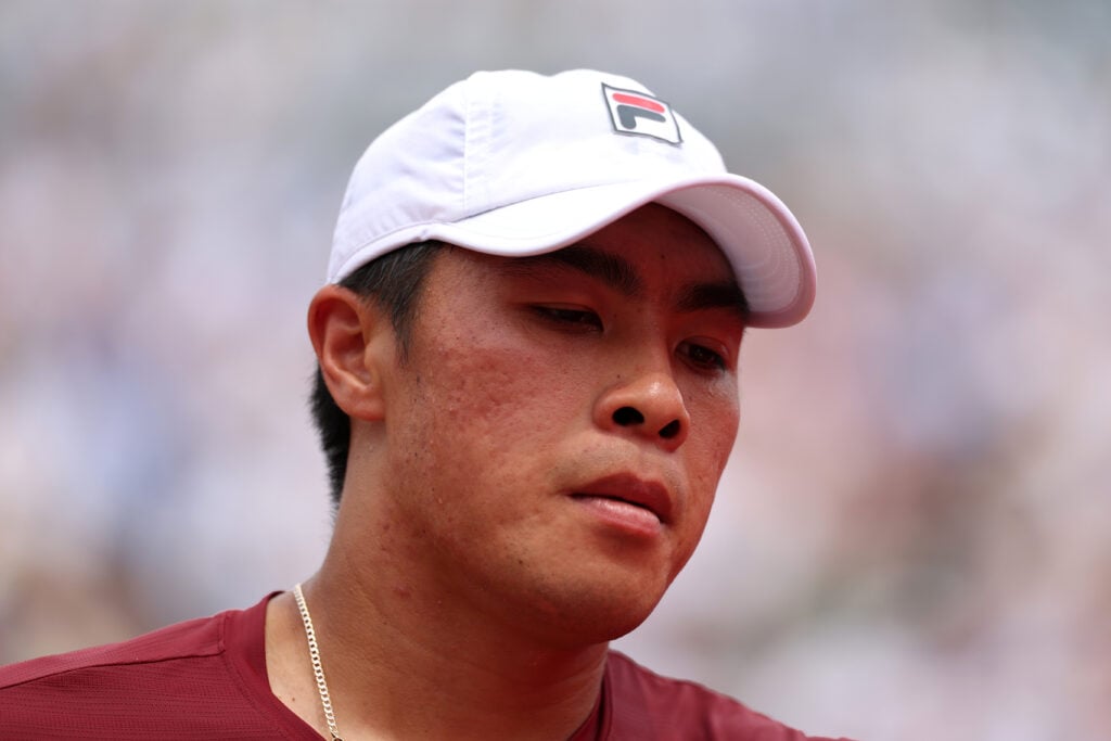 Brandon Nakashima looks on during his match with Jack Draper at the 2025 Queen's Club Championships