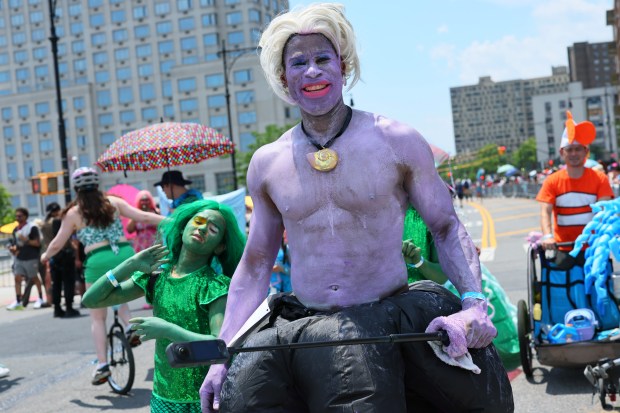 NEW YORK, NEW YORK - JUNE 21: People in a variety of colorful costumes participate in the 43rd annual Mermaid Parade at Coney Island on June 21, 2025 in New York City. The annual Mermaid Parade marks the beginning of summer in NYC and pays tribute to Coney Island's Mardi Gras celebrations in the early 1900's. (Photo by Michael M. Santiago/Getty Images)