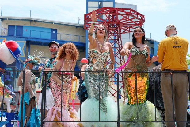 NEW YORK, NEW YORK - JUNE 21: People in a variety of colorful costumes participate in the 43rd annual Mermaid Parade at Coney Island on June 21, 2025 in New York City. The annual Mermaid Parade marks the beginning of summer in NYC and pays tribute to Coney Island's Mardi Gras celebrations in the early 1900's. (Photo by Michael M. Santiago/Getty Images)