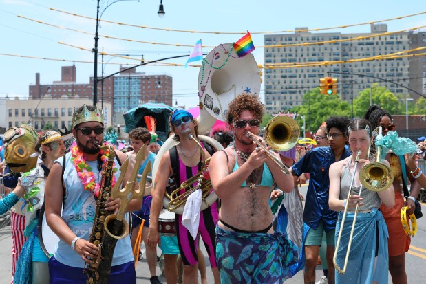 NEW YORK, NEW YORK - JUNE 21: People in a variety of colorful costumes participate in the 43rd annual Mermaid Parade at Coney Island on June 21, 2025 in New York City. The annual Mermaid Parade marks the beginning of summer in NYC and pays tribute to Coney Island's Mardi Gras celebrations in the early 1900's. (Photo by Michael M. Santiago/Getty Images)