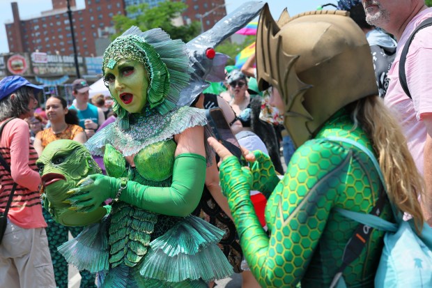 NEW YORK, NEW YORK - JUNE 21: People in a variety of colorful costumes prepare to participate in the 43rd annual Mermaid Parade at Coney Island on June 21, 2025 in New York City. The annual Mermaid Parade marks the beginning of summer in NYC and pays tribute to Coney Island's Mardi Gras celebrations in the early 1900's. (Photo by Michael M. Santiago/Getty Images)