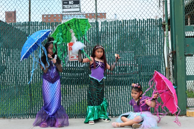 NEW YORK, NEW YORK - JUNE 21: People in a variety of colorful costumes prepare to participate in the 43rd annual Mermaid Parade at Coney Island on June 21, 2025 in New York City. The annual Mermaid Parade marks the beginning of summer in NYC and pays tribute to Coney Island's Mardi Gras celebrations in the early 1900's. (Photo by Michael M. Santiago/Getty Images)