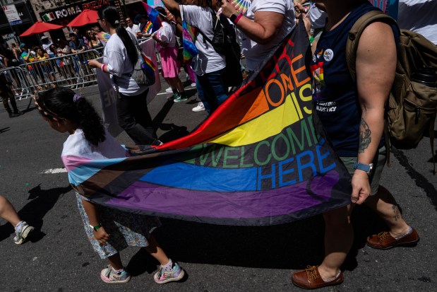 NEW YORK, NEW YORK - JUNE 29: People take part in the 2025 NYC Pride March on June 29, 2025 in New York City. The annual Pride parade is expected to draw more than a million people for the largest Pride event in North America. It will feature 60 floats and over 75,000 marchers. (Photo by Adam Gray/Getty Images)
