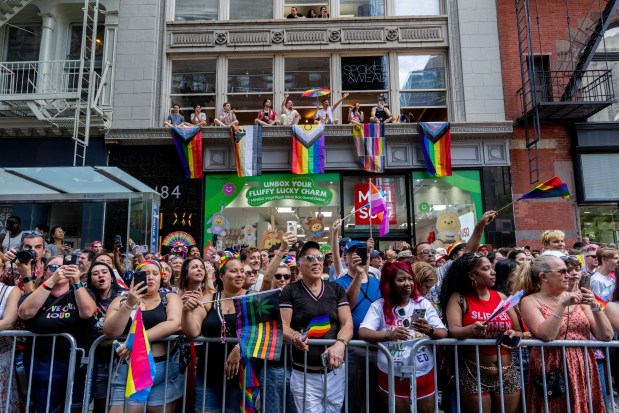 NEW YORK, NEW YORK - JUNE 29: Crowds watch as people take part in the 2025 NYC Pride March on June 29, 2025 in New York City. The annual Pride parade is expected to draw more than a million people for the largest Pride event in North America. It will feature 60 floats and over 75,000 marchers. (Photo by Adam Gray/Getty Images)