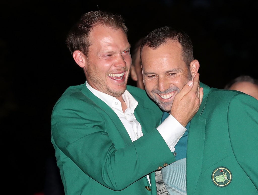 Danny Willett celebrates with Sergio Garcia after winning The Masters