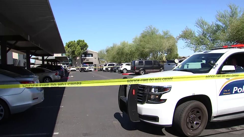 Crime scene tape could be seen in the parking lot.