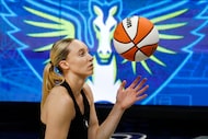 Dallas Wings guard Paige Bueckers warms up before an WNBA basketball game against the...