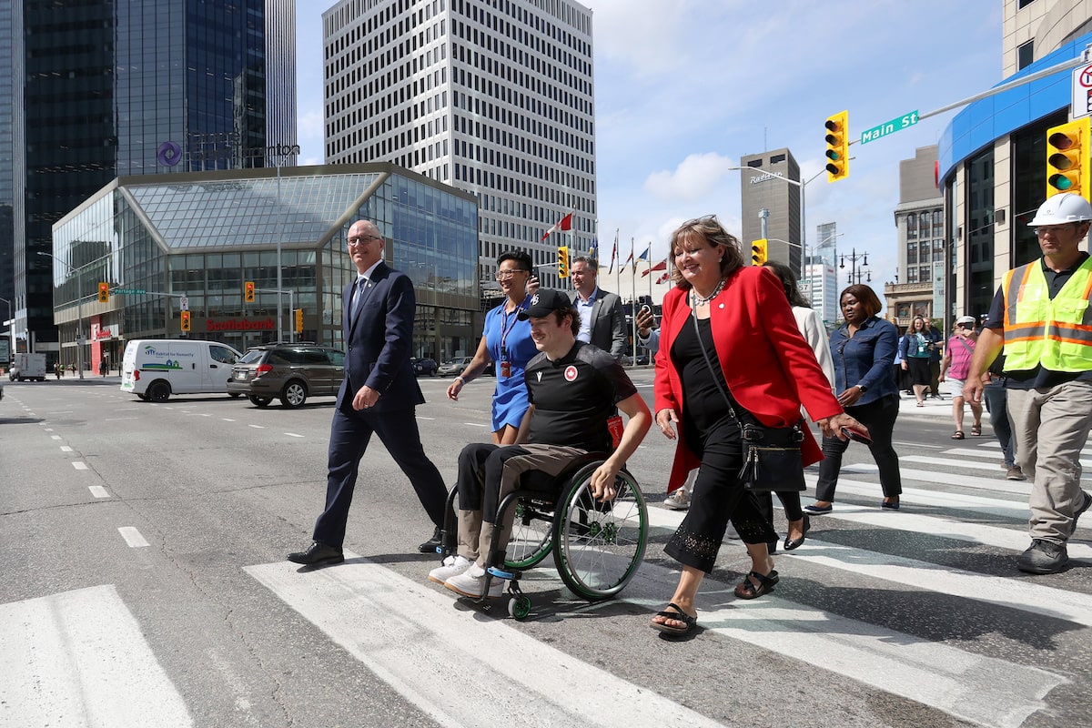 Pedestrians reclaim Portage and Main as Winnipeg reopens the famed intersection after 46 years